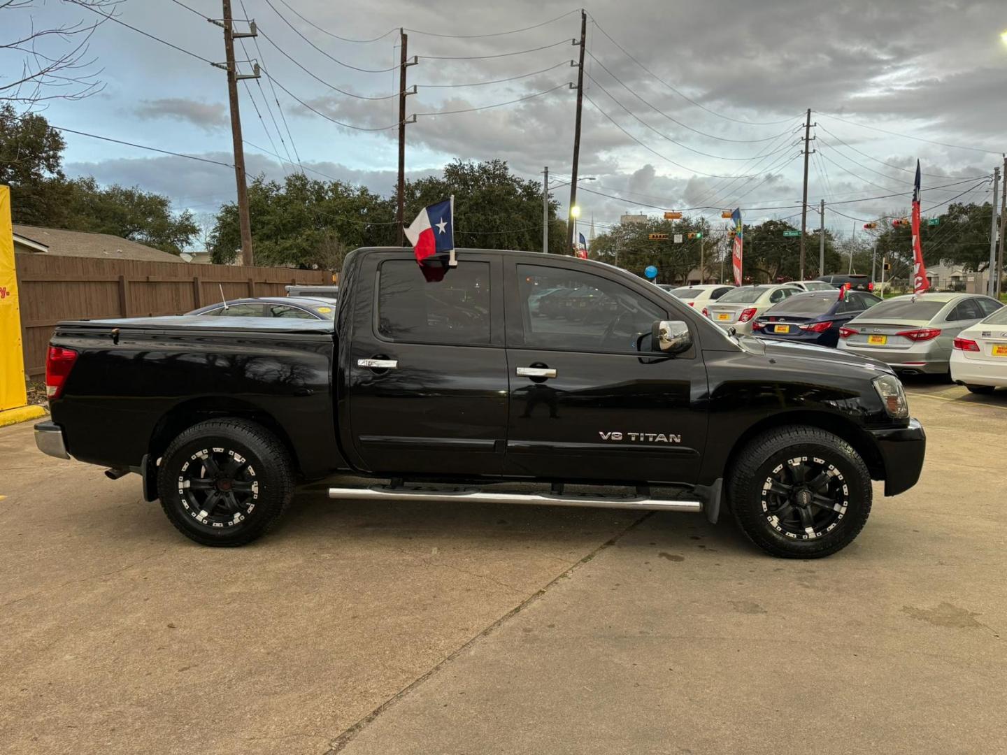 2012 Nissan Titan (1N6BA0ED2CN) , located at 16710 Clay Rd., Houston, TX, 77084, (281) 859-7900, 29.834864, -95.656166 - Photo#1